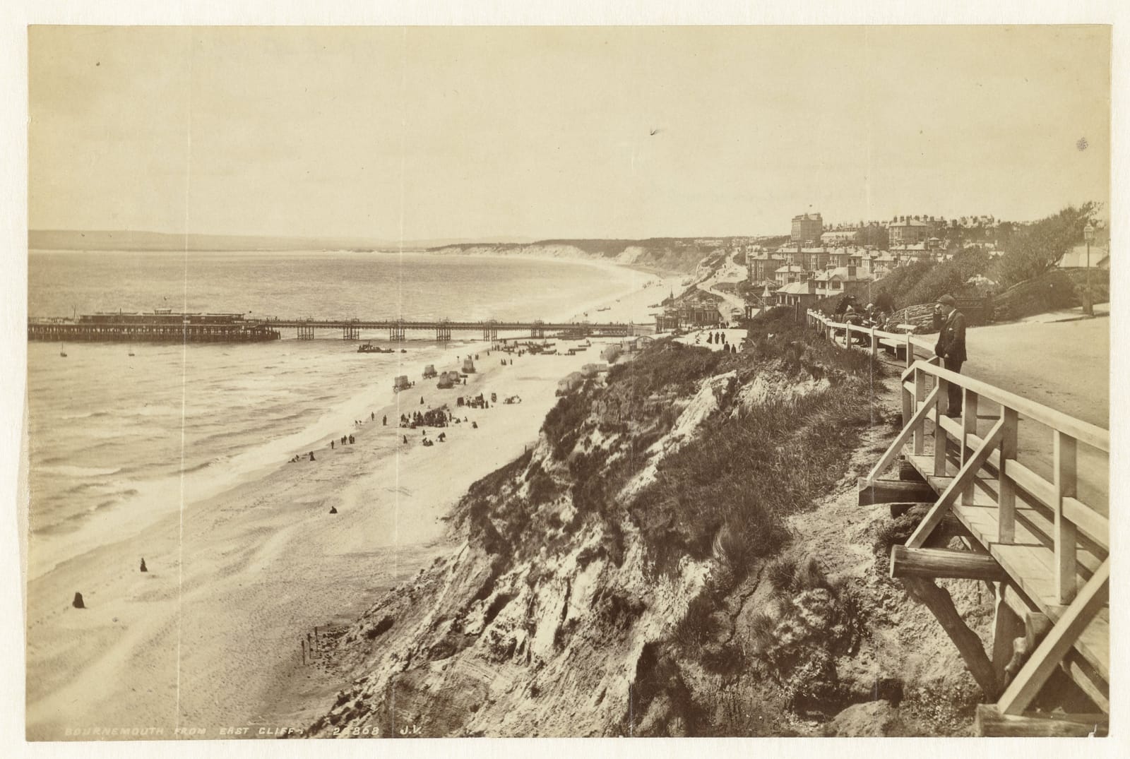 A photograph from the cliff path down to the beach and pier at Bournemouth.