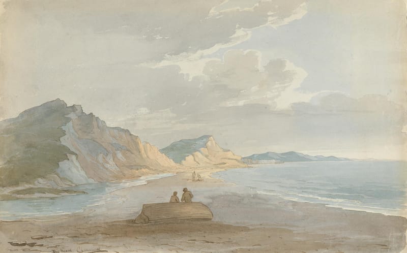 Grey cliffs and a headland running along a quiet beach, with two figures on a rock by the water.