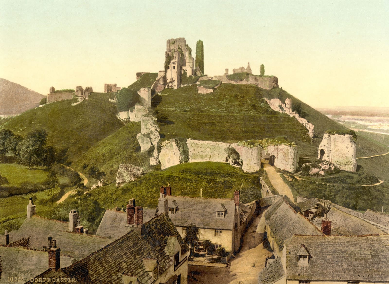 The ruined castle on its green hill above the stone roofs of Corfe village.