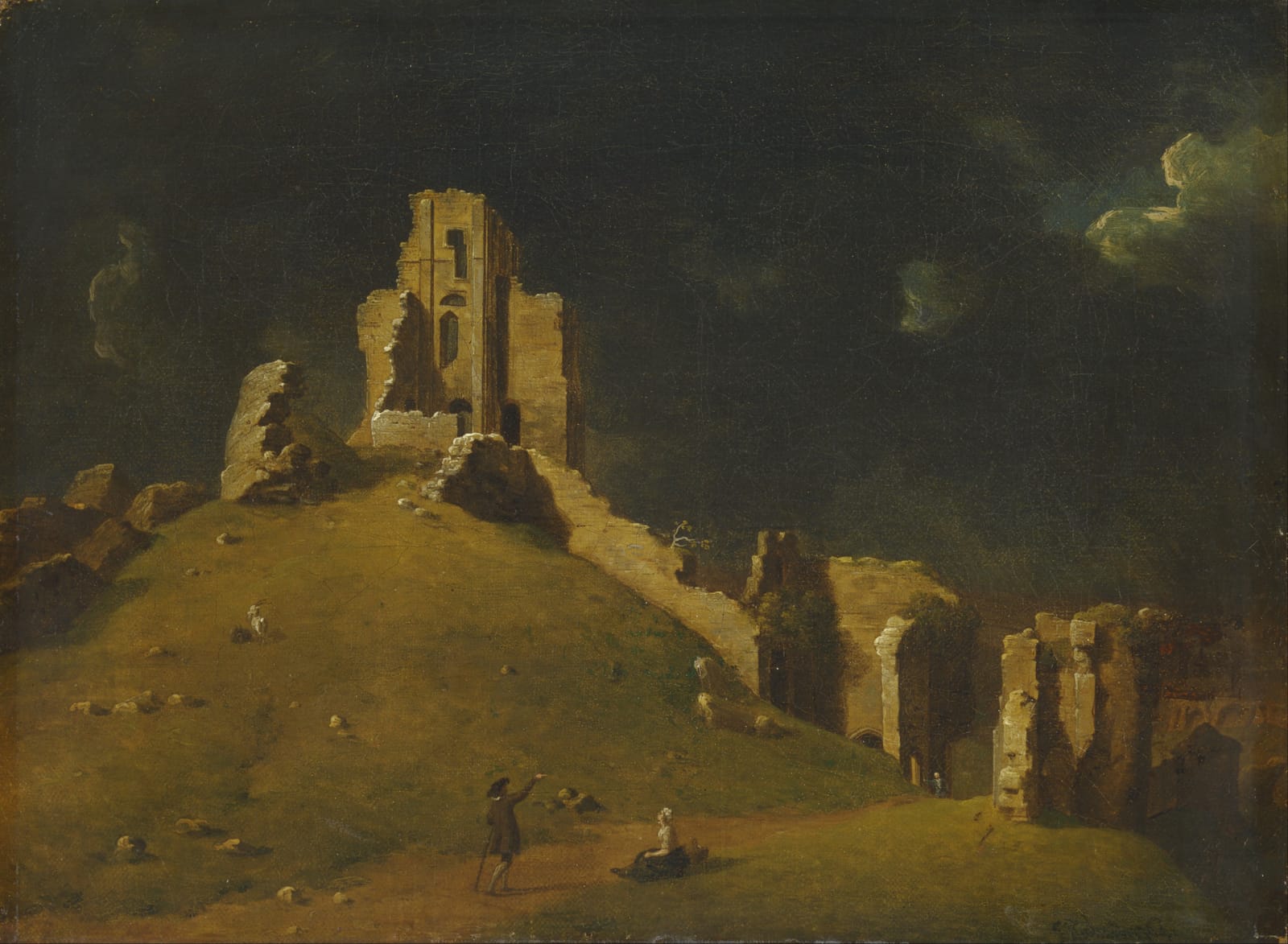 The dark ruins of Corfe Castle on their hill against a stormy sky, with small figures on the grass below.