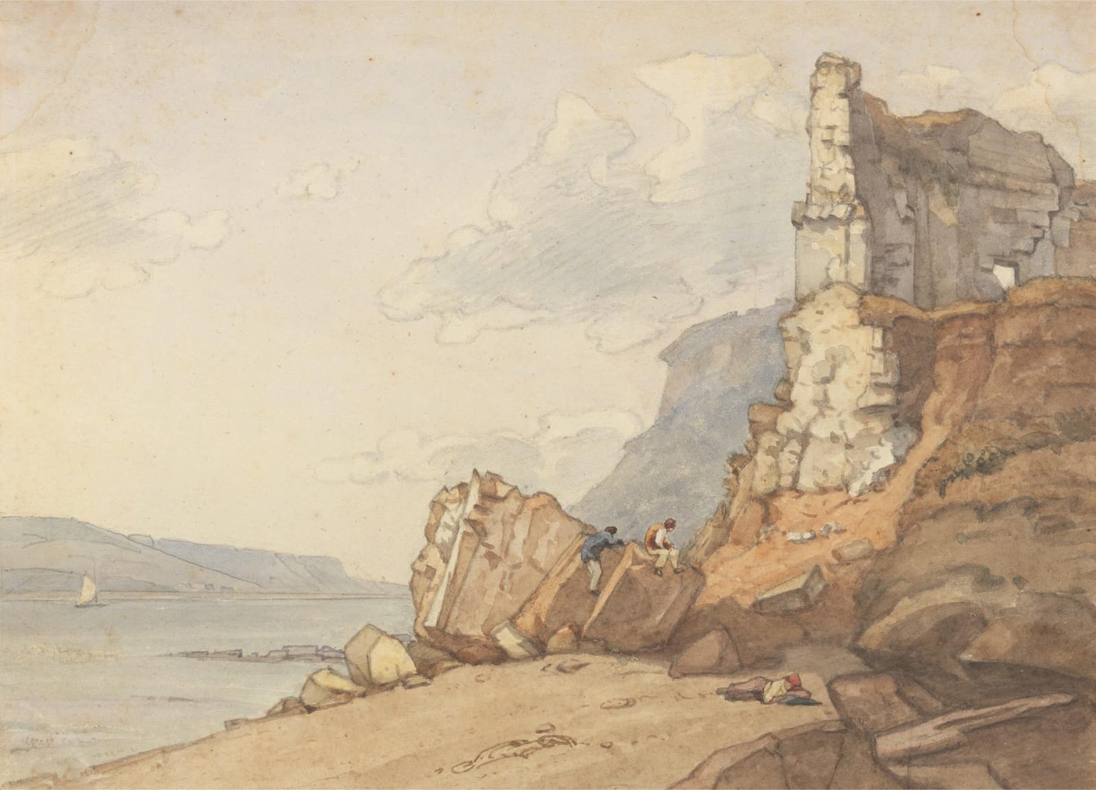 A ruined stone tower on the edge of a rocky cliff, with the sea and a distant headland beyond.
