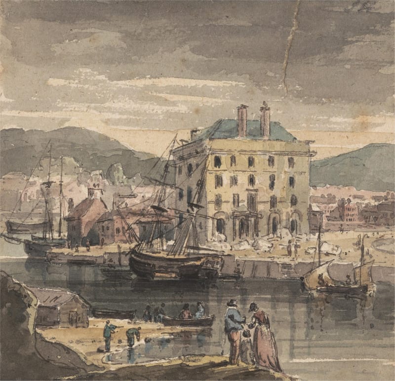 Sailing ships moored at Weymouth quay in front of a tall pale building, with people on the quayside.
